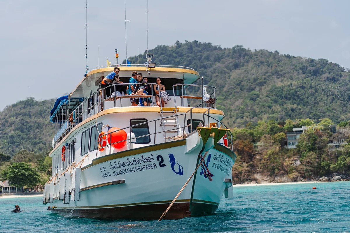 Luxury scuba diving boat anchored near tropical island in Phuket Thailand