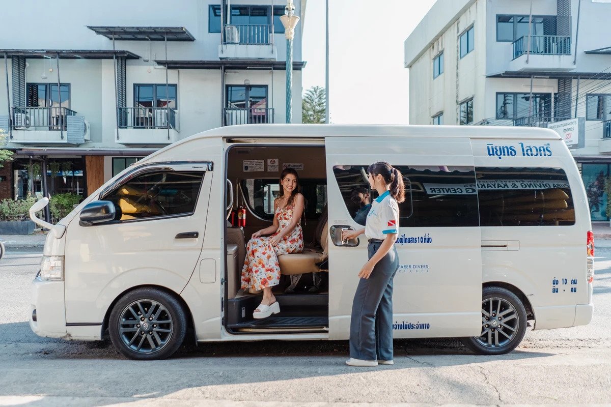 Guest boarding Seafarer Divers Phuket transfer van for a diving trip
