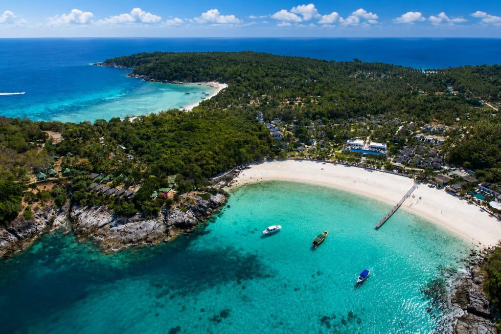 “Aerial view of tropical beach and turquoise water at Racha Island near Phuket Thailand”